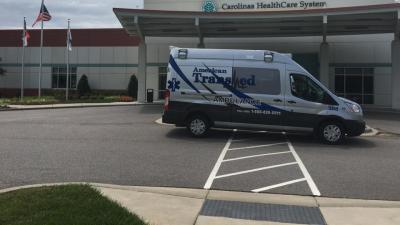 American Transmed Ambulance in front of Carolinas Healthcare System